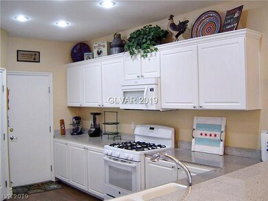 White cabinets & white appliances = bright kitchen