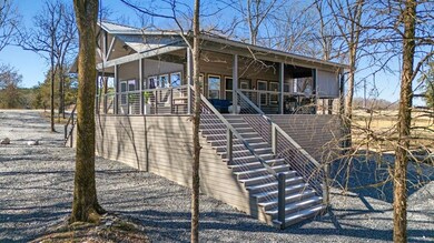 Chalet / cabin featuring covered porch, stairway, 