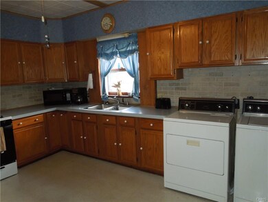 Large eat-in kitchen located near back of house wi