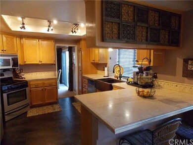 Remodeled kitchen w/ugpraded tile counters and flo