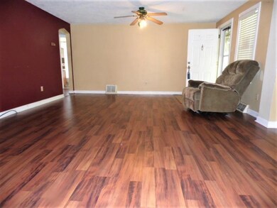 ENTER THE HUGE GREAT ROOM. GLEEMING LAMINATE FLOOR