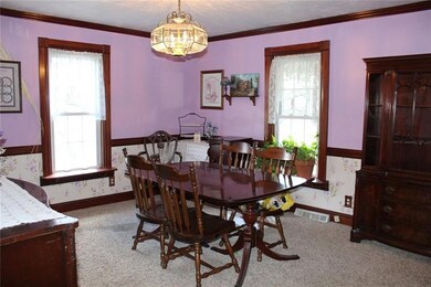 Dining Room with crown molding and chair rail just