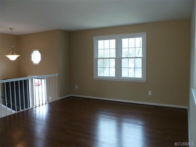 Living Room - Upstairs Front of House - New Wood Flooring - View of Front Door and Foyer - New Chandelier