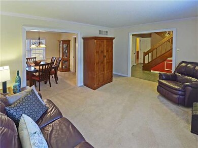 Formal living room off entry has large picture win