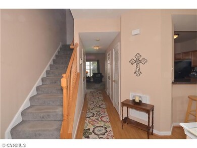 Foyer - The foyer has laminate wood floors, a coat