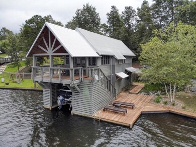 House includes covered boat slip and separate jet