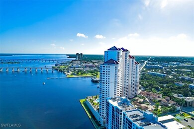 Birds eye view of property with a water view