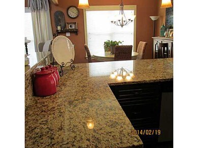 Granite counter tops with room for chairs at the bar! Tiled floors! House made for entertaining.