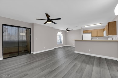 Unfurnished living room featuring light wood-style