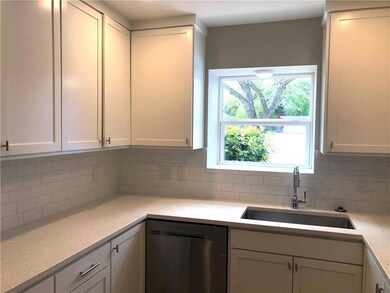 Kitchen featuring dishwasher, tasteful backsplash