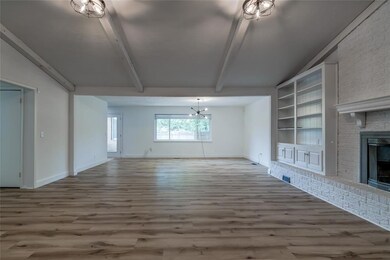 Unfurnished living room featuring built in feature