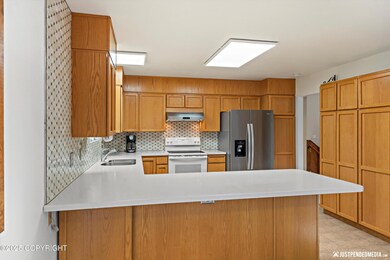 Stairs Lead to Spacious/Bright Kitchen