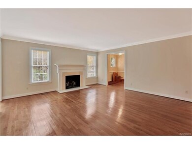 Spacious formal living room with hardwood floor an