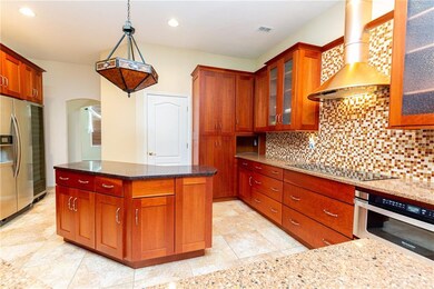 Behind the kitchen is the dining room and laundry