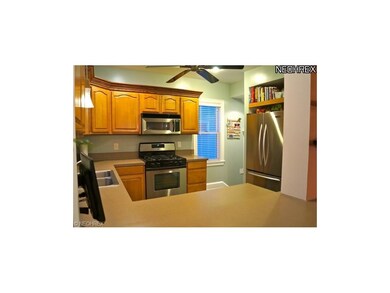 Gorgeous two tone cabinetry and all stainless appliances.