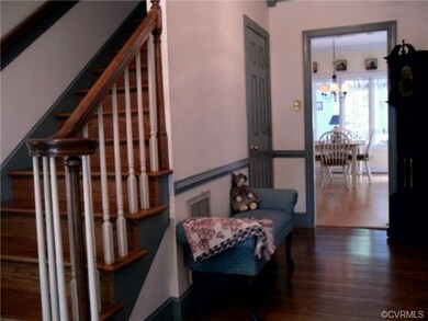 Front staircase is hardwood with stained handrails
