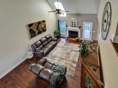View from the top of the stairs overlooking into the family room 