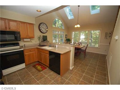Kitchen - Updated eat-in kitchen with granite coun