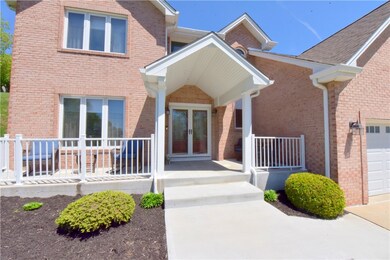 pretty newer front porch, railing, doors ad overha