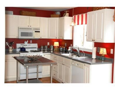 Kitchen. Bright and Airy Kitchen Opens to Dining A