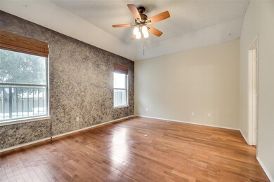Unfurnished room with light wood finished floors and ceiling fan
