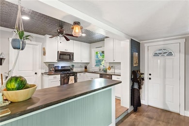 Kitchen featuring appliances with stainless steel 