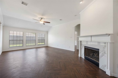 This spacious living room features elegant wood fl