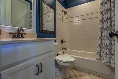 Full bath off downstairs guest bedroom.