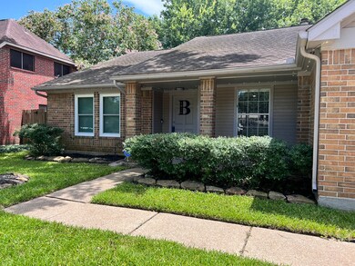 Inviting pathway leading you to the covered porch to enter the home.