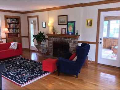 Living Room. Lovely stone fireplace accents spacio