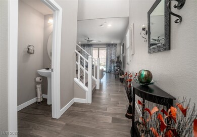 Corridor featuring dark wood-type flooring and a textured wall