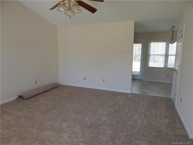 Living Room with cathedral ceiling- new carpet thr