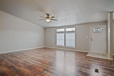 Living room with large windows, front door