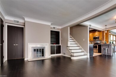 A marble hearth at the fireplace, and built in cab