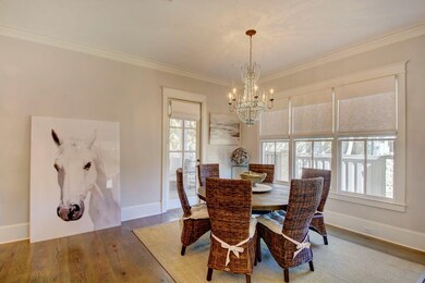 Dining area opens onto rear screened in porch and