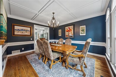 Dining space featuring a chandelier, wood finished