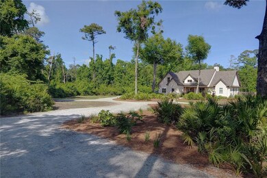 Drive 500 feet off Lawrence Road through a canopy