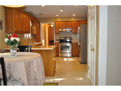 The spacious eat-in kitchen features new appliance