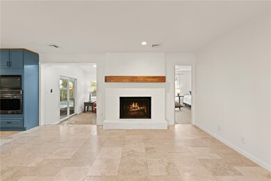 Sunroom on left, entrance to primary ensuite on th