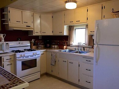 Kitchen. Neutral cabinets, new stove and refrigera