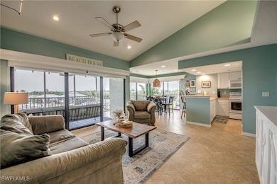 Living area featuring ceiling fan, lofted ceiling,