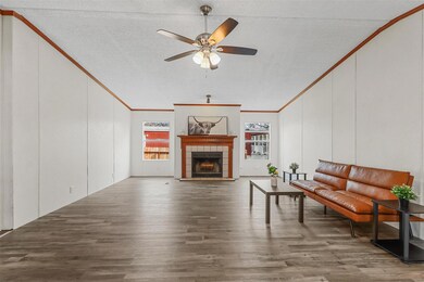 Unfurnished living room featuring wood-type floori