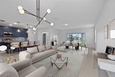 Living area with light tile patterned floors, recessed lighting, and a chandelier