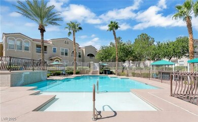 Community pool with a patio and fence