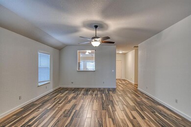 Unfurnished room featuring a textured ceiling, dar