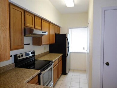 KITCHEN WITH SMOOTH-TOP OVEN/RANGE.