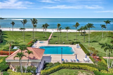 Community pool featuring a water view, a hot tub,