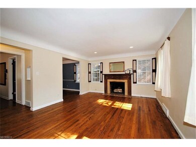 SPACIOUS FORMAL LIVING ROOM HAS WOOD FLOORING, FIR