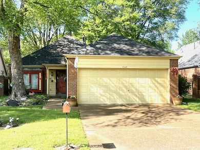 Single story home featuring roof with shingles, a 