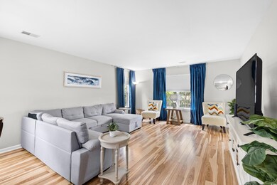 Living area featuring light wood finished floors a